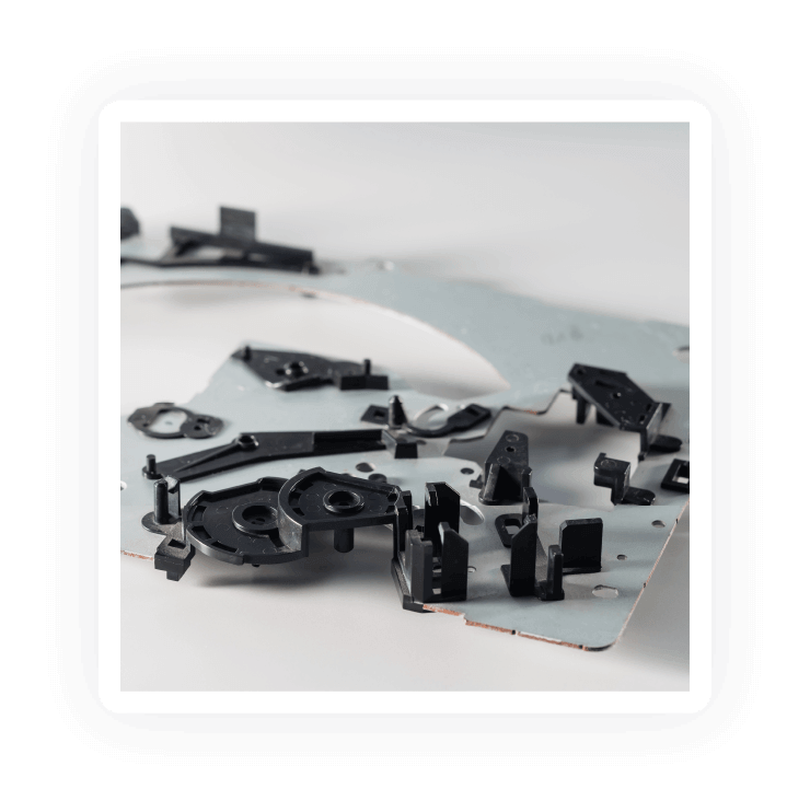 Outsert products with resin pins inserted into chassis